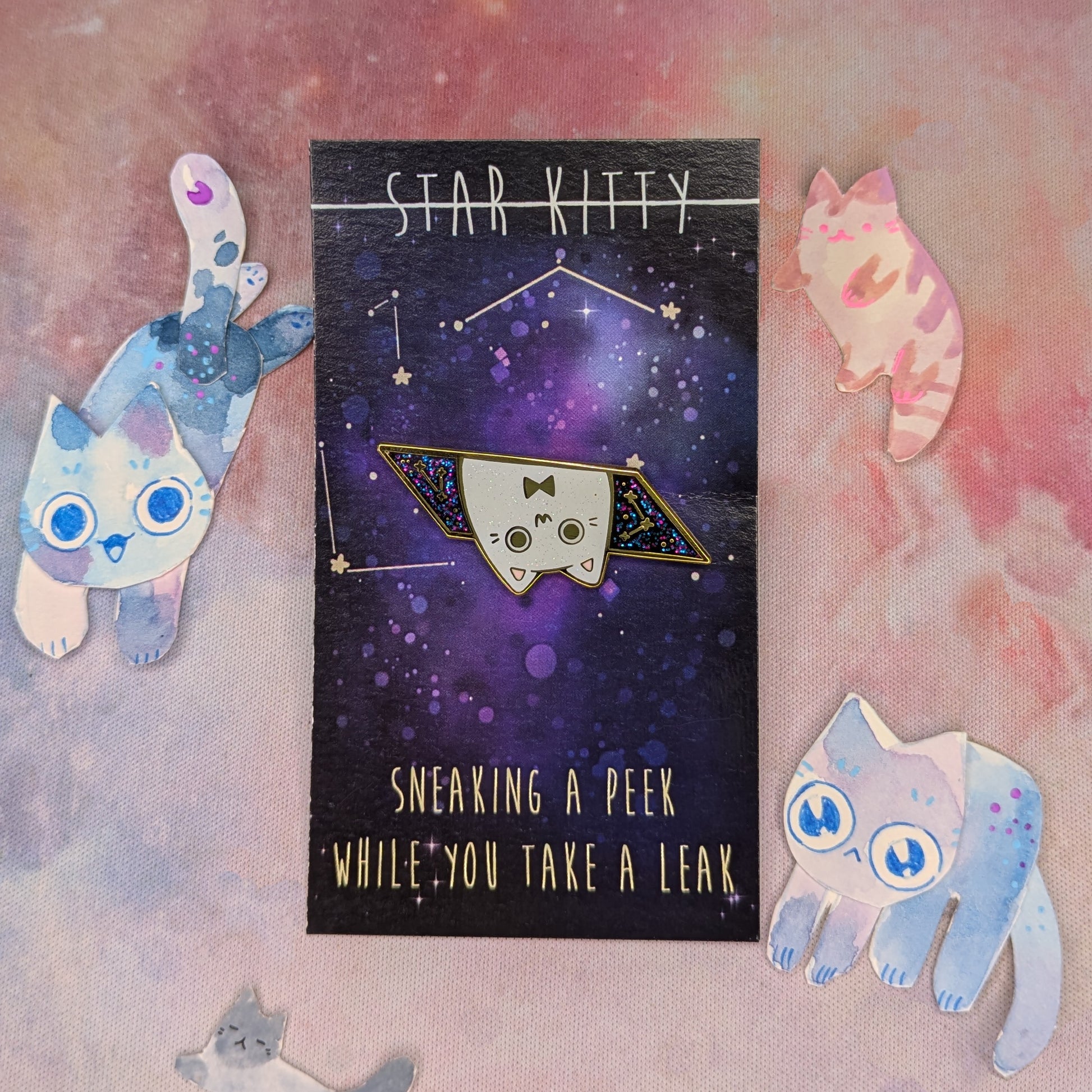 Star Kitty pin with a space-themed card and cat illustrations on a colorful background